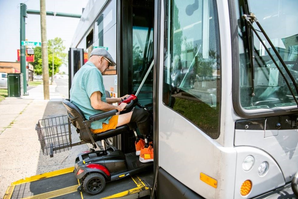 Disabled person boarding a bus